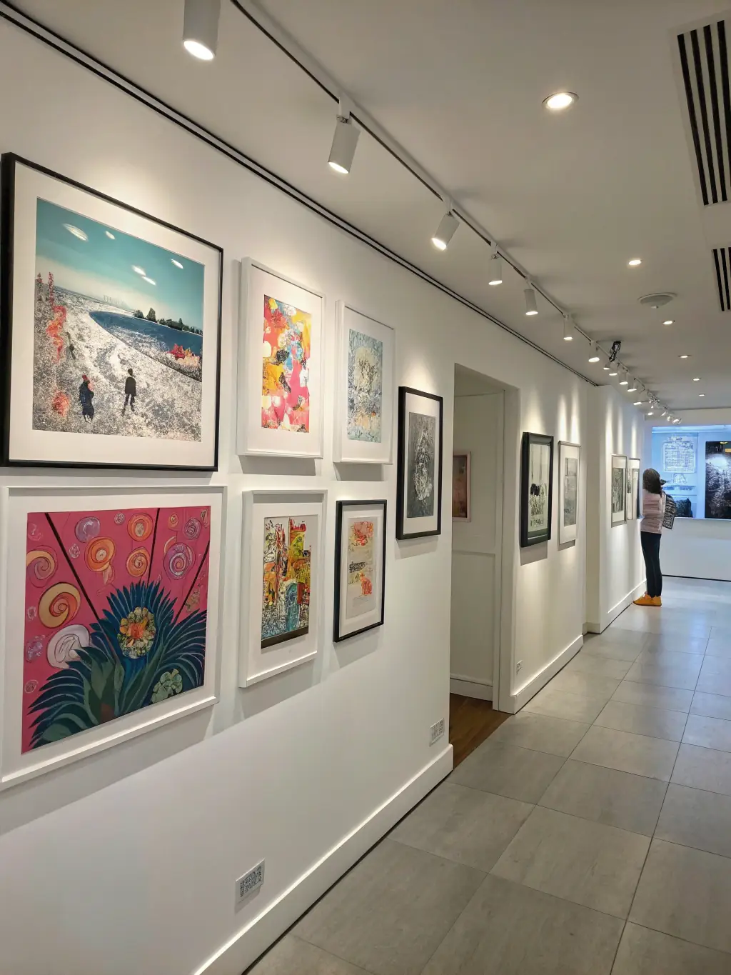 An image of finished screen-printed artworks displayed in a gallery setting, highlighting the quality and diversity of the creations produced through COUTEAU's programs.